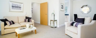 Bright and spacious living room area with seating