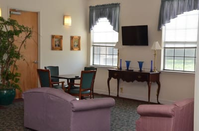 A cozy interior common area with seating and decor