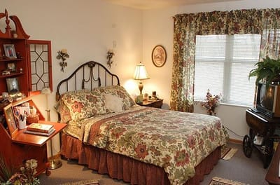 Cozy bedroom with floral decor and warm lighting