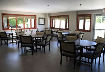 Bright dining area with tables and chairs