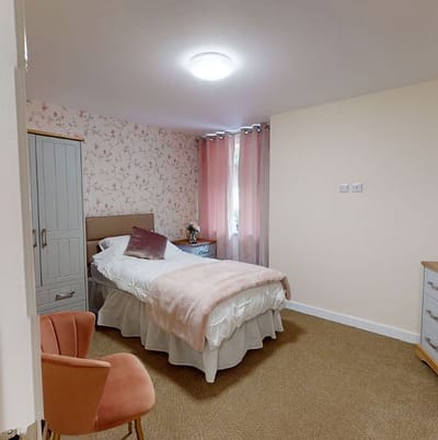 Cozy private resident room with floral wallpaper