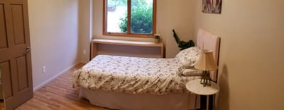 Cozy private resident room with a bed and window