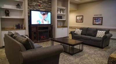 Cozy common area with seating and a television