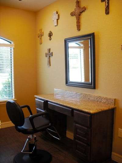 Interior view of a salon area with a styling chair