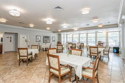 Dining area with tables and chairs in a common room