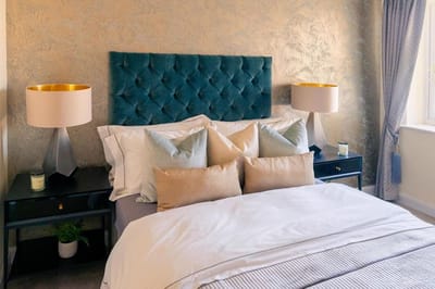 Cozy bedroom with modern decor and lighting