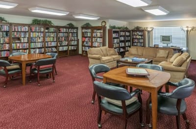 Cozy interior of a library with bookshelves and seating