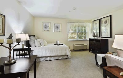 A well-decorated resident room with furniture