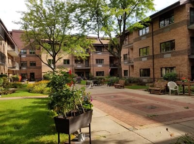 Courtyard area with walking paths and flowerbeds