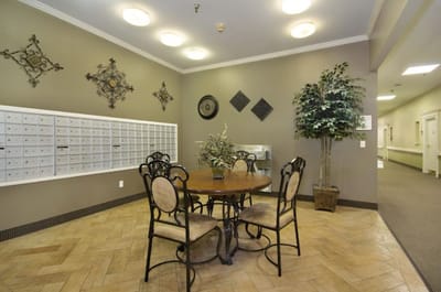 Common area with a table and mailboxes