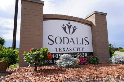 Sodalis Texas City facility sign with colorful landscaping