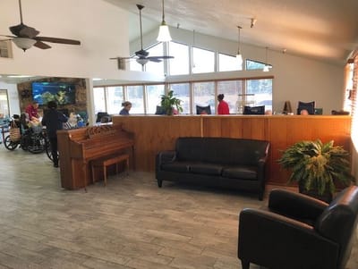 Interior common area with seating and residents