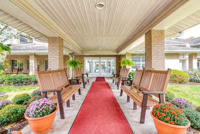 Entrance area with benches and flower pots outside