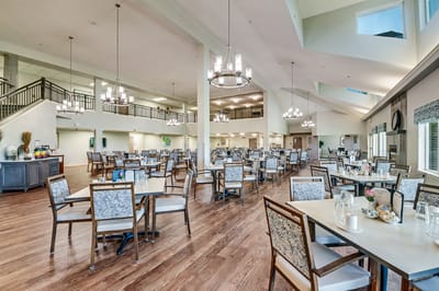 Interior view of a bright dining room with chairs and tables