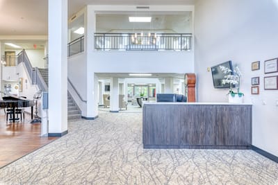 Bright and spacious interior lobby area with reception