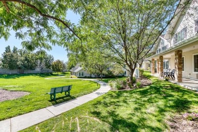 Well-maintained outdoor area with path and bench