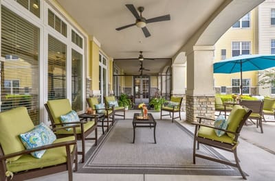Outdoor seating area with comfortable chairs and plants