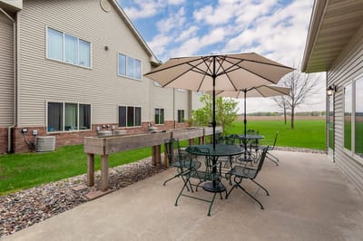 Outdoor patio area with tables and umbrellas