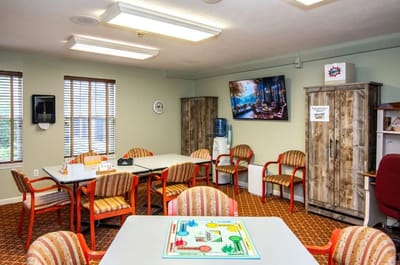 Bright common area with seating and games