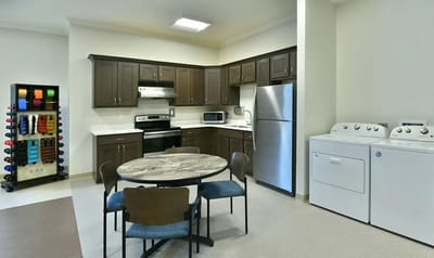 Interior kitchen with dining table and appliances