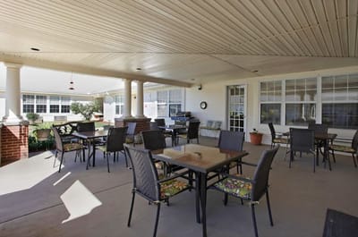 Outdoor dining area with tables and chairs