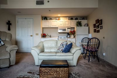 A cozy resident room with a kitchen area