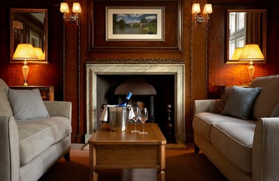 Well-furnished common area with a cozy fireplace