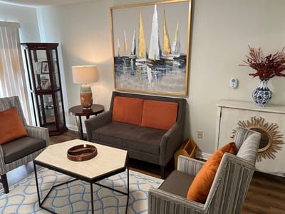 Cozy common area with modern furniture and artwork