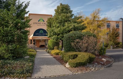 Exterior view of Spring Creek Healthcare Center with landscaping