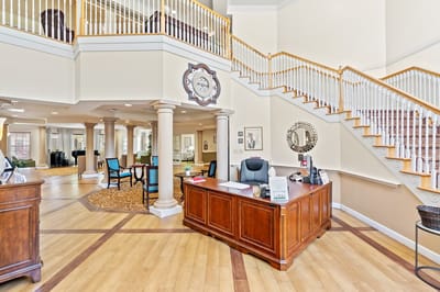 Bright lobby area with reception desk and seating