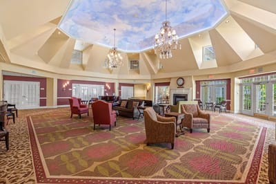 Spacious common area with seating and decorative ceiling