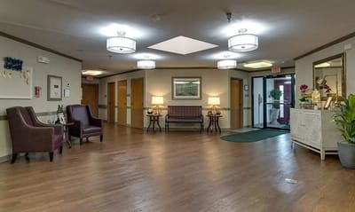 Interior view of a nursing home lobby with seating