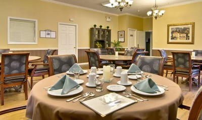 Dining area set with tables and dinnerware
