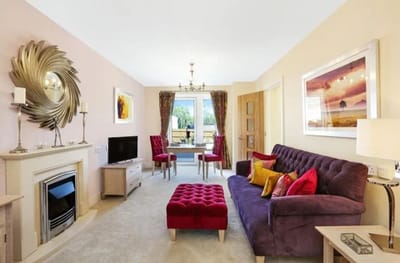 Cozy living room with comfortable seating and a fireplace