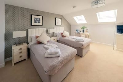 A bright and spacious resident room with two beds