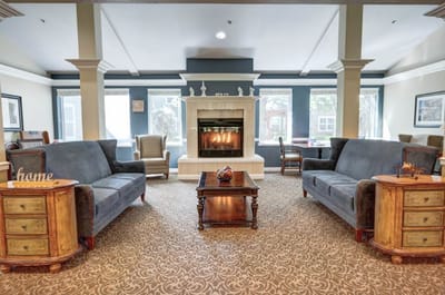 Cozy common area with seating and a fireplace