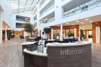 Bright interior of the facility lobby and information desk