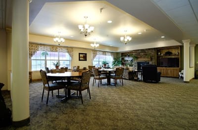 Common area with tables and chairs in an inviting setting