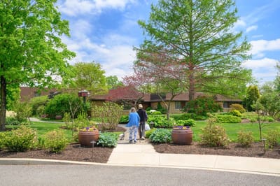 Residents walking through a beautiful outdoor garden path