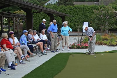 Residents enjoying a game of golf outdoors