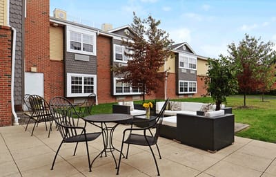 Outdoor seating area with landscaping and chairs