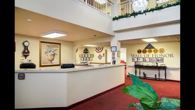 Interior view of a common area with a reception desk
