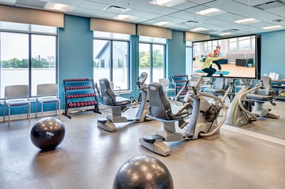 Residents engaging in group exercise in a fitness room