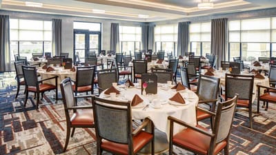 Dining area set for a meal with elegant table settings