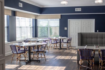 Bright dining area with wicker chairs and tables