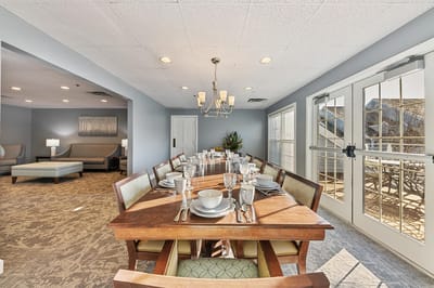 Dining area with a large table set for a meal