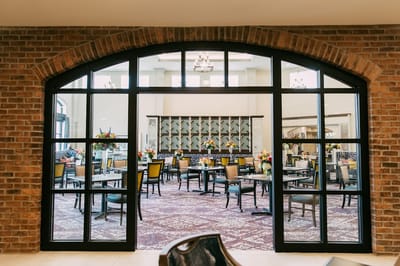 Interior dining area with floral arrangements and seating