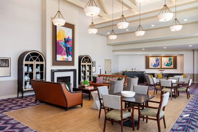 A cozy lounge area with stylish seating and artwork
