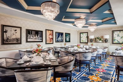 Elegant dining room with floral decor and evening lighting