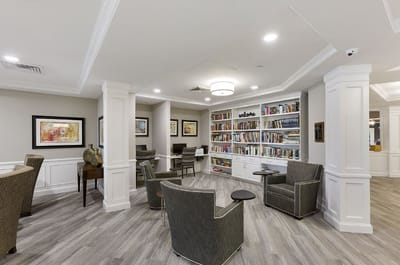 Common area with bookshelves and seating